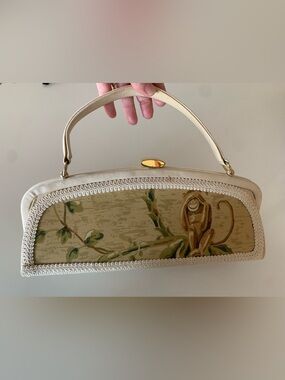 Soshe Cream Clutch Handbag with Playful Monkey Motif